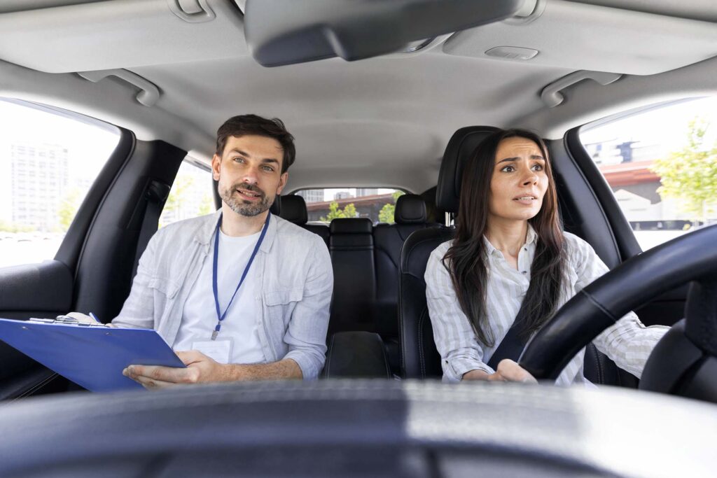 unconfident-millennial-pretty-woman-driving-car-wi-J24N37N.jpg